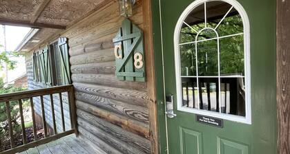 C8, Two bedroom, two bath log-sided, lake view luxury cottage with hot tub by RedAwning