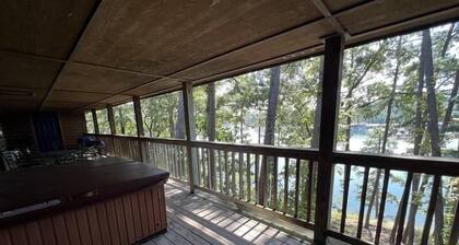 C16, Two bedroom, two bath, log-sided Harbor North luxury cottage with hot tub overlooking Lake Ouachita. by RedAwning