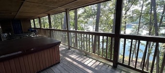 C16, Two bedroom, two bath, log-sided Harbor North luxury cottage with hot tub overlooking Lake Ouachita. by RedAwning