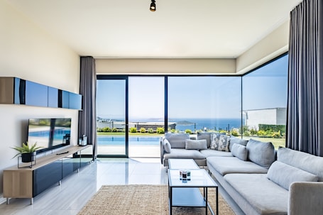 Deluxe Villa | Living area | 43-inch Smart TV with satellite channels, TV. Bovilla Hotels Yalikavak