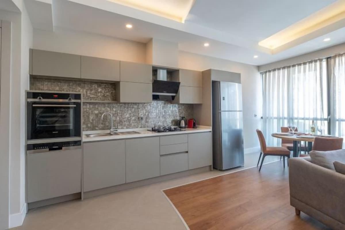 Private kitchen | Full-size fridge, microwave (on request), oven, stovetop