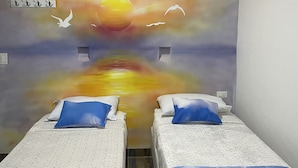 Habitación básica con 1 cama doble o 2 individuales, baño privado