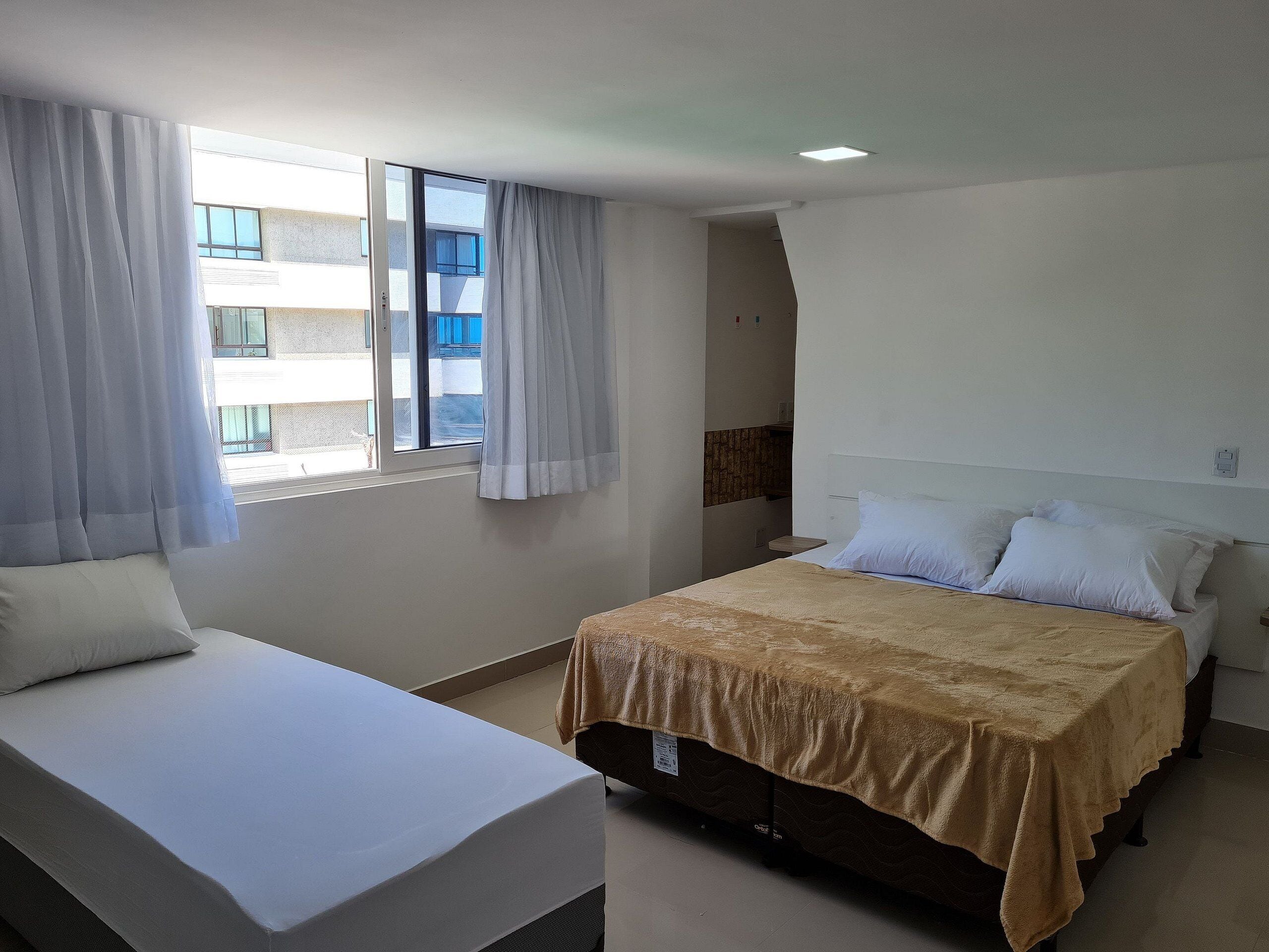 Apartamento | Wi-Fi de cortesia, roupa de cama