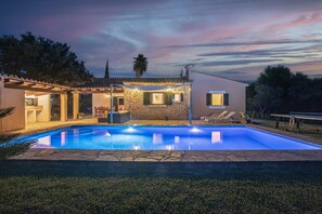 A swimming pool with a stone deck, a covered patio, and a view of the surrounding landscape. - Majorca holiday rental - Villa Joana (Pollensa / Pollença)