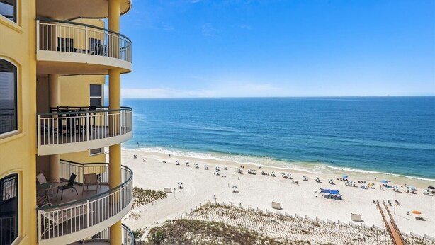 A multi-story building with balconies overlooking a beach. - Beach Colony East 10D - Indoor Pool - HASSLE-FREE CHECK OUT (Perdido Key)