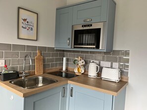 Fridge, microwave, toaster, cookware/dishes/utensils