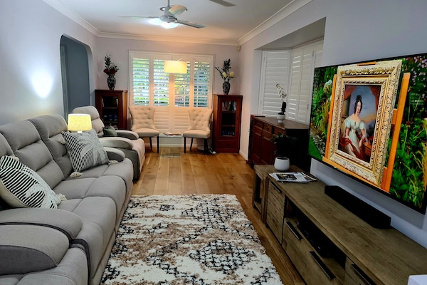 Lounge room with recliners that you'll really want to come home to.
