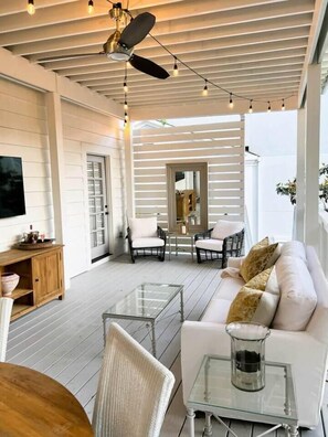 A spacious living area with a ceiling fan, string lights, a sofa, chairs, and a coffee table. - Walk to Campus & Square*Pets Welcome*Luxury Home (Oxford)