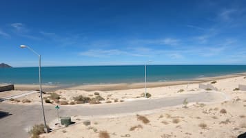 On the beach, sun-loungers