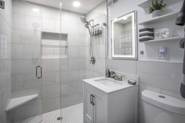 Shower, hair dryer, towels, soap
