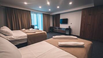 Family Room | 1 bedroom, minibar, individually furnished, desk