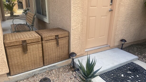 A front entrance with wicker baskets, a door, a small step, and a doormat. - Private access, private room, private bathroom (Goodyear)