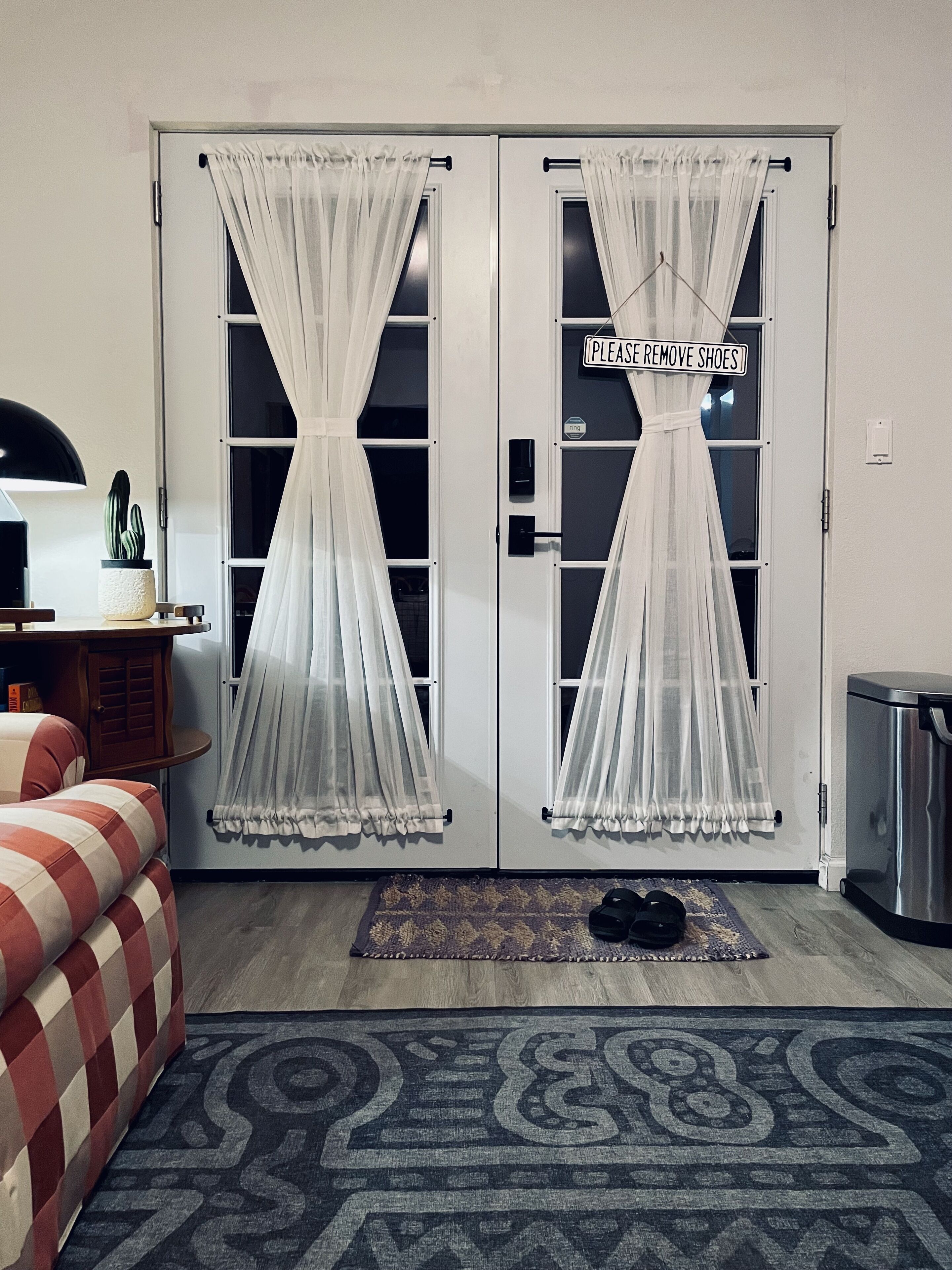 Semi-sheer front door curtains maintain privacy while filtering direct sunlight.