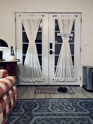 Semi-sheer front door curtains maintain privacy while filtering direct sunlight.