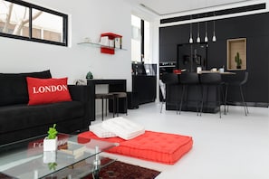 Design Apartment | Living area | 60-inch flat-screen TV with cable channels, TV, streaming services