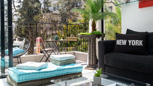 Design Apartment | Living area | 60-inch flat-screen TV with cable channels, TV, streaming services - New Design & Sunny Balcony in TLV Center (Tel Aviv)