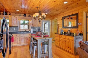 Fridge, microwave, oven, stovetop - With stunning mountain views, Altitude Adjustment invites pets to enjoy its charm, featuring a hot tub, double outdoor fireplace, & WiFi (Morganton)
