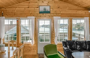 Enjoy a panoramic view of the river and surrounding landscape from this room's high ceiling.