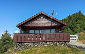 Enjoy a tranquil retreat with a balcony offering views of the surrounding landscape.