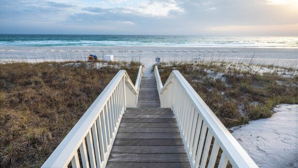 A wooden boardwalk leading to a beach with a clear view of the ocean. - Walk to the Waves- Gorgeous Carillon Beach Bungalow (Panama City Beach)