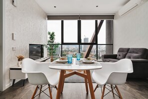 Family Apartment, 1 Bedroom, Non Smoking, City View | Living area | 49-inch Smart TV with digital channels, TV, fireplace - Scarletz KLCC Apartments By Soulasia (Kuala Lumpur)