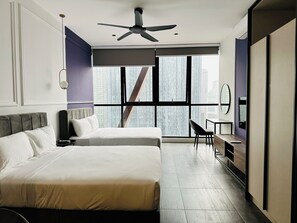 Family Quadruple Room, 2 Queen Beds, Non Smoking, City View | Living area | 49-inch Smart TV with digital channels, TV, fireplace - Scarletz KLCC Apartments By Soulasia (Kuala Lumpur)
