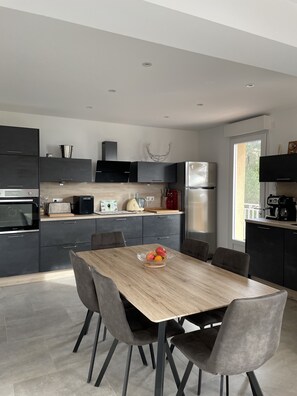 Enjoy cooking in this well-lit kitchen with ample counter space and a central island.