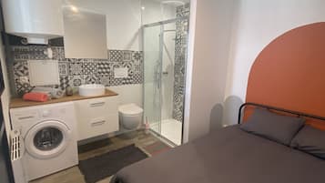 Shower, hair dryer, towels, toilet paper