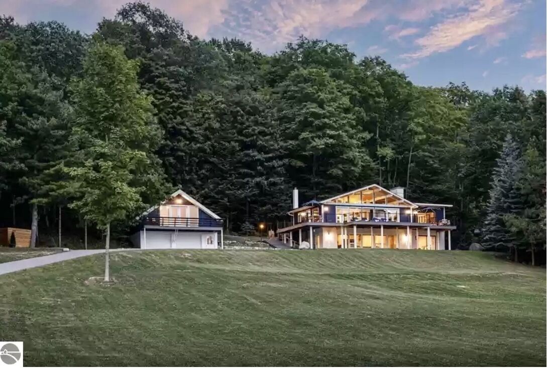 Spectacular view of Lake Michigan on wooded 37 acres access to beautiful beach