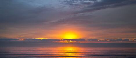 On the beach, sun loungers, beach towels
