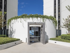 Enter a sleek, modern space through the elegant archway.