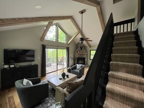 Smart TV, fireplace, books, stereo