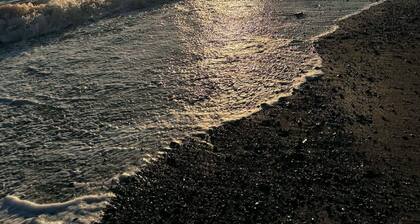 Newly renovated cottage. 30 second walk to the beach. New hot tub addition!