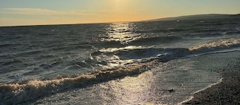 Newly renovated cottage. 30 second walk to the beach. New hot tub addition!