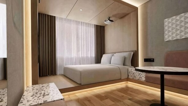 A modern hotel room with a bed, a sofa, a small table, and a TV. - Mushang hotel (Yiyang)