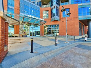 A modern building with a glass entrance and a sign that reads 'KEYNOTE ONE'.