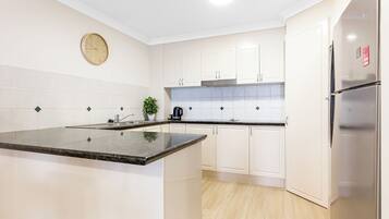 Family Apartment | Private kitchen | Full-size fridge, microwave, oven, stovetop
