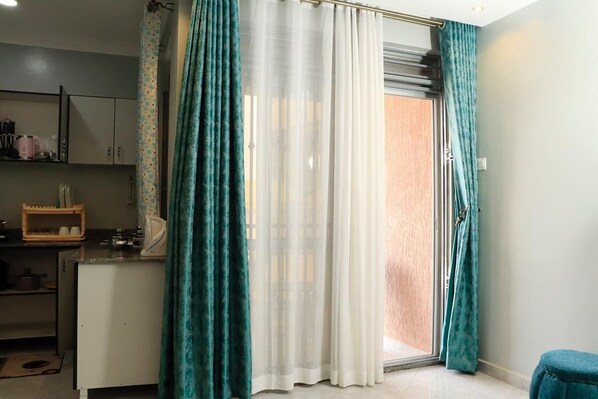 Deluxe Apartment | Living area | 43-inch Smart TV with digital channels, TV - 5s Villa Uganda (Kampala)