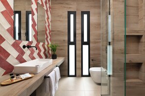 Shower, hair dryer, towels, toilet paper