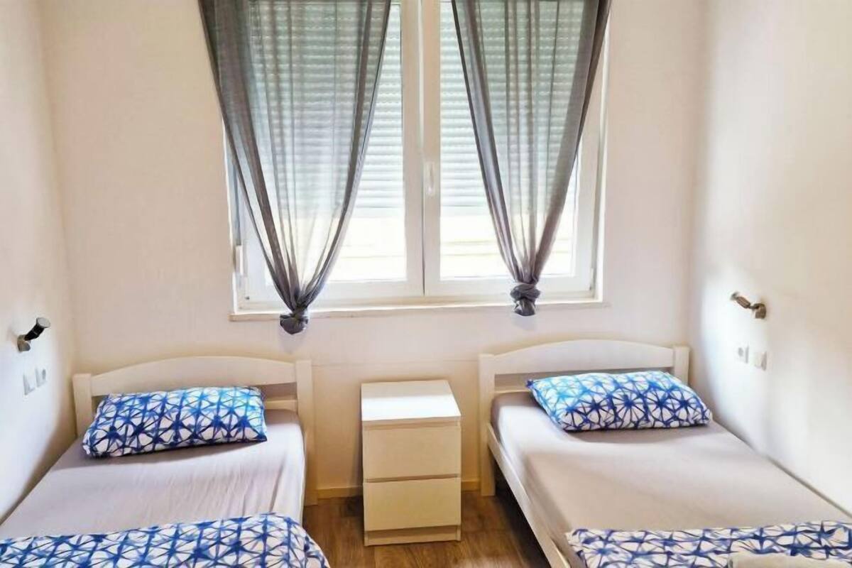 Desk, laptop workspace, free WiFi, bed sheets