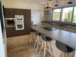 Fridge, electric kettle, high chair