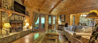 Nestled by the babbling creek, Creekside Hideaway warmly welcomes pets, offering a hot tub, over-sized screened porch with TV, firepit, and WiFi