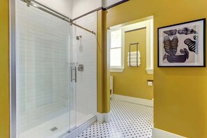 Shower, hair dryer, towels, shampoo