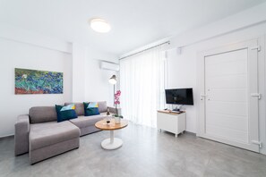 Duplex, 3 Bedrooms | Living area | 40-inch Smart TV with cable channels, TV - Dionysos Residential Complex (Pangaio)