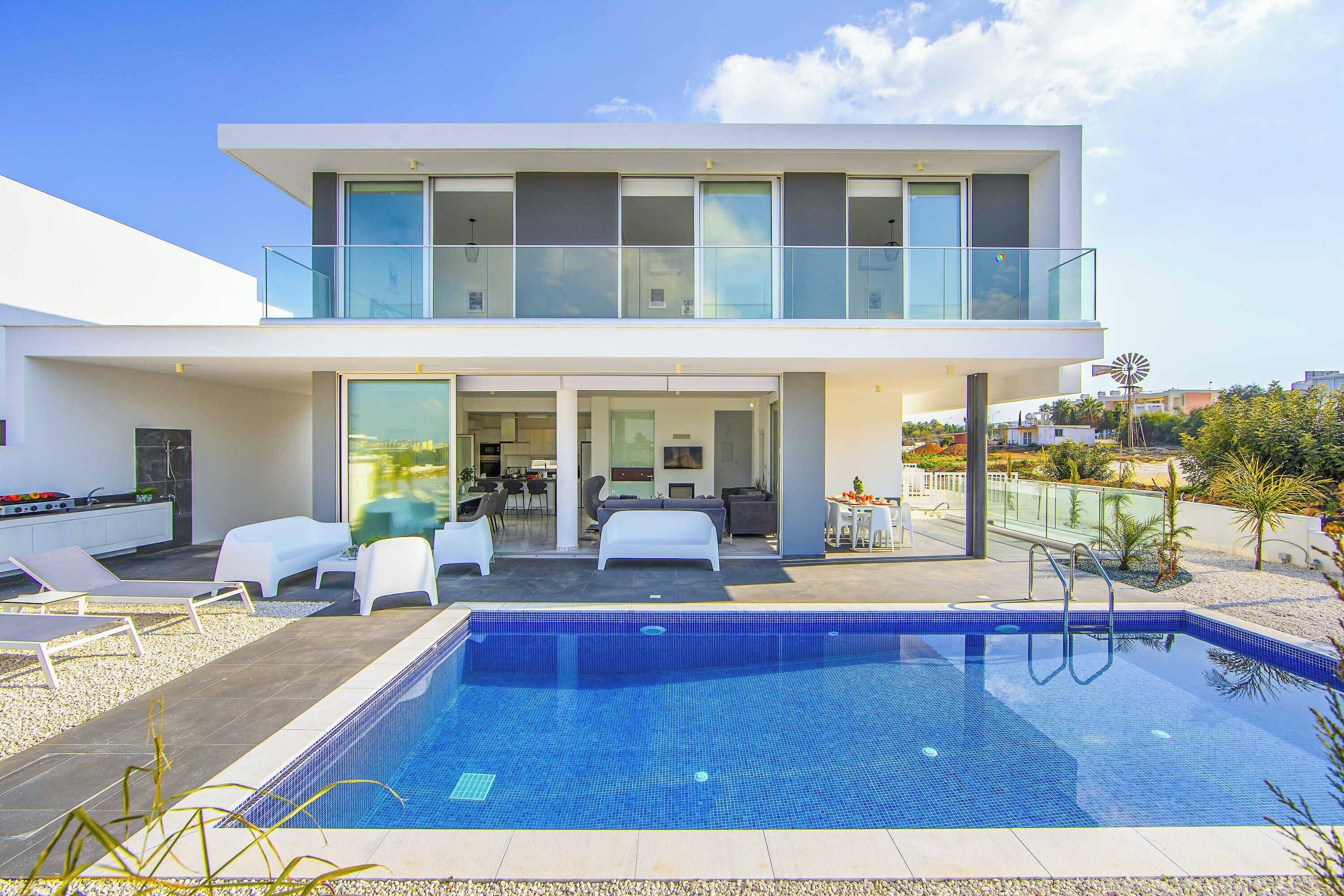 A heated pool, sun loungers