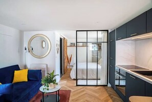 A modern apartment with a living area, a kitchen, and a bedroom. - Independent, peaceful cocoon in the heart of the village - sleeps 4 (Échenevex)