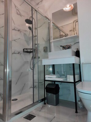 Shower, hair dryer, towels, soap