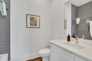 Bathtub, hair dryer, towels