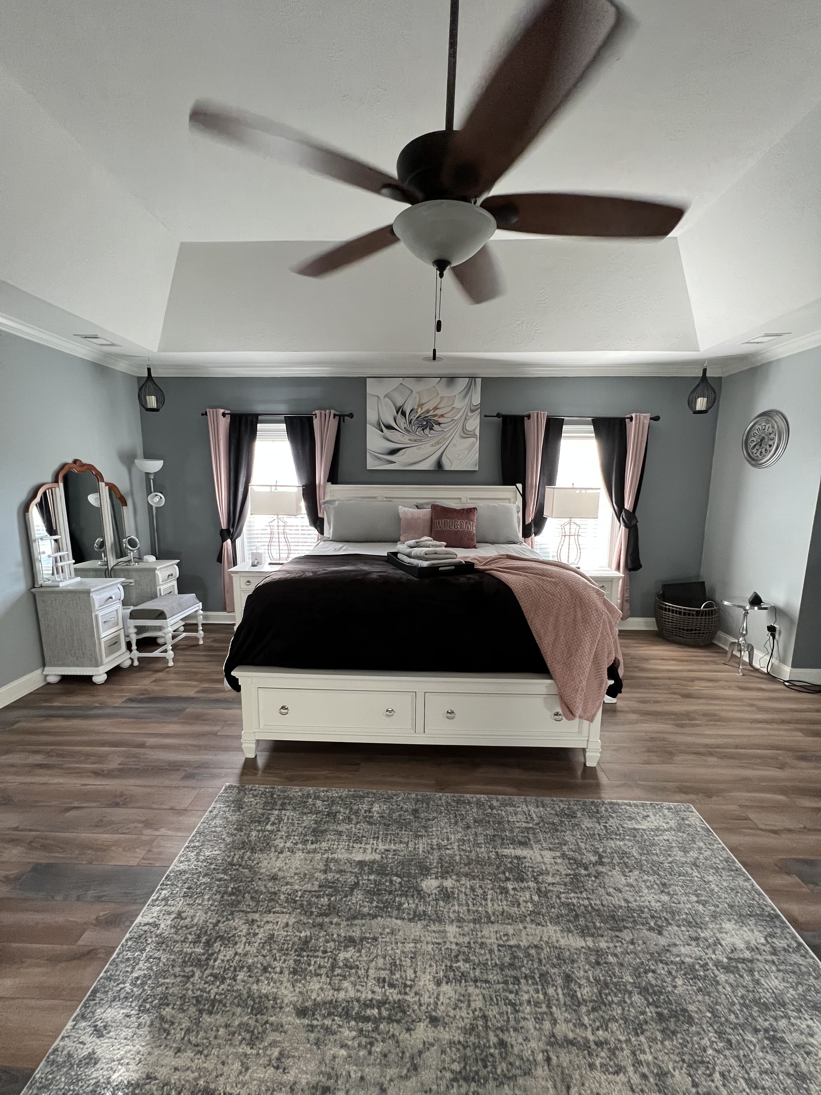 Master bedroom. King size bed with sitting area and desk