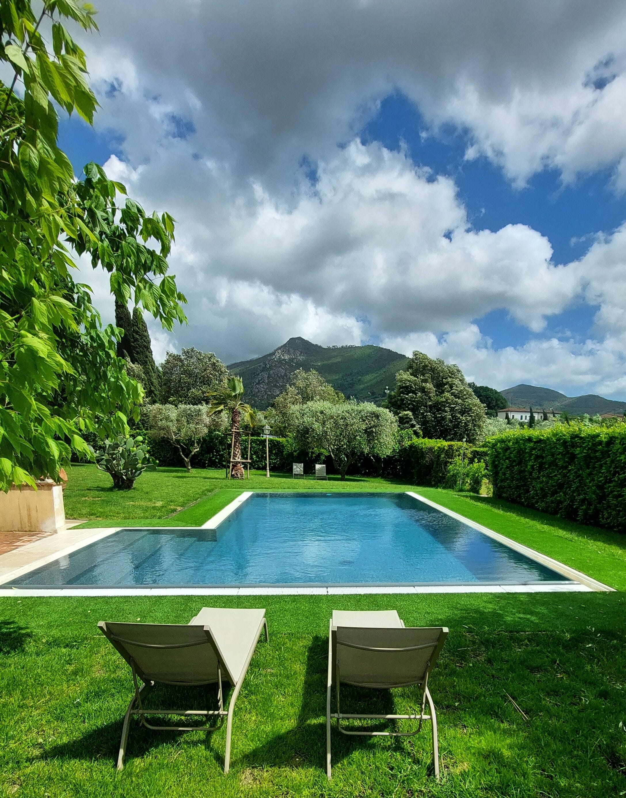 Seasonal outdoor pool, open 9:00 AM to 7:00 PM, pool umbrellas